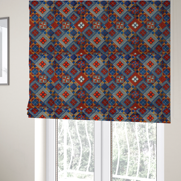 The fabric used to create these Roman blinds is a geometric African wax print fabric featuring an intricate repeating pattern of nested diamonds, squares, and triangular motifs.