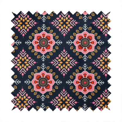 A repeating folk-art textile design featuring alternating rows of stylized pink floral blossoms and intricate diamond-shaped geometric motifs.