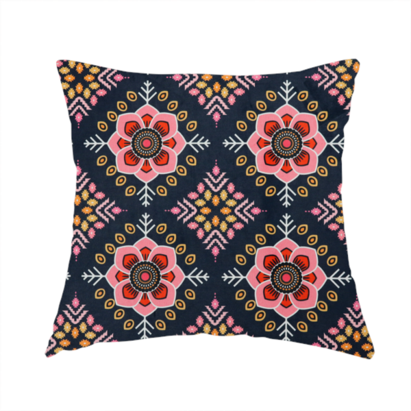 The fabric used to create this handmade cushion is a repeating folk-art textile design featuring alternating rows of stylized pink floral blossoms and intricate diamond-shaped geometric motifs.