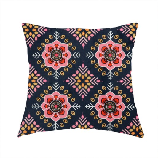 The fabric used to create this handmade cushion is a repeating folk-art textile design featuring alternating rows of stylized pink floral blossoms and intricate diamond-shaped geometric motifs.