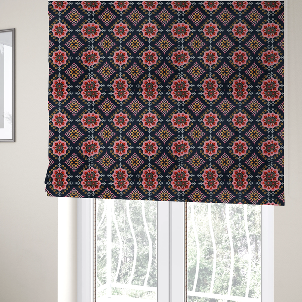 The fabric used to create these Roman blinds is a repeating folk-art textile design featuring alternating rows of stylized pink floral blossoms and intricate diamond-shaped geometric motifs.