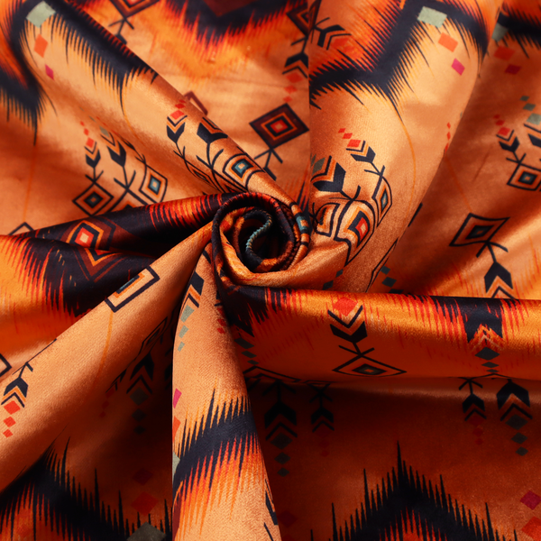 An Aztec-inspired tribal ikat fabric featuring horizontal bands of sharp zigzags and diamond motifs.