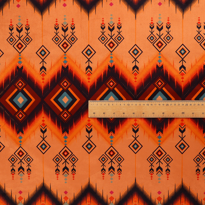 An Aztec-inspired tribal ikat fabric featuring horizontal bands of sharp zigzags and diamond motifs.