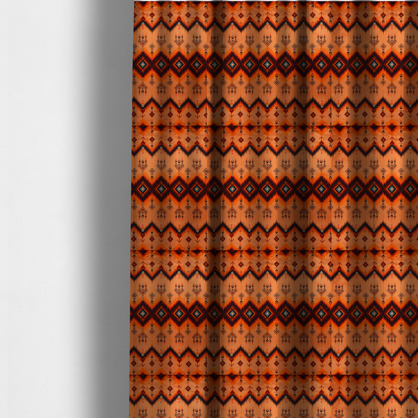The fabric used to create these made-to-measure curtains is a Aztec-inspired tribal ikat fabric featuring horizontal bands of sharp zigzags and diamond motifs.