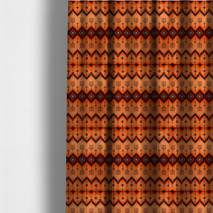 The fabric used to create these made-to-measure curtains is a Aztec-inspired tribal ikat fabric featuring horizontal bands of sharp zigzags and diamond motifs.