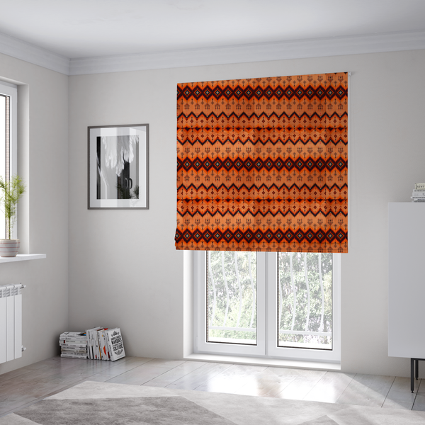The fabric used to create these Roman blinds is an Aztec-inspired tribal ikat fabric featuring horizontal bands of sharp zigzags and diamond motifs.