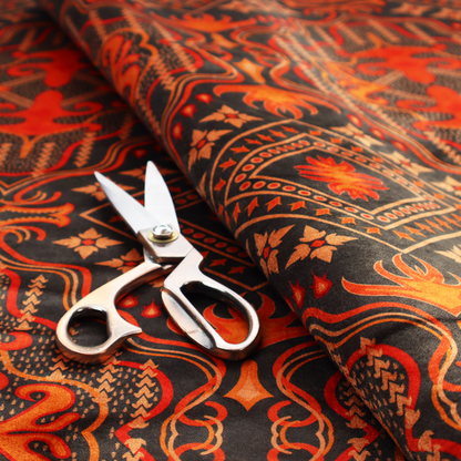 An ornate damask and tribal-inspired textile pattern featuring large symmetrical medallions interspersed with diamond shapes.