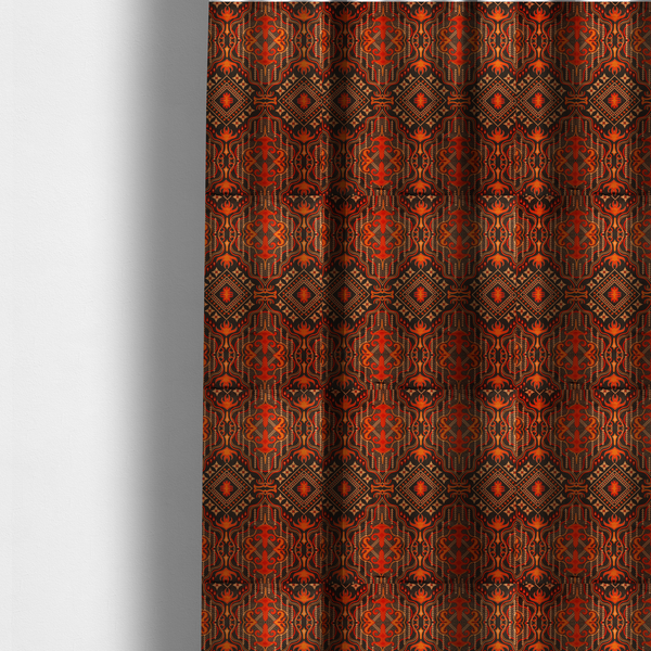The fabric used to create these made-to-measure curtains is an ornate damask and tribal-inspired textile pattern featuring large symmetrical medallions interspersed with diamond shapes.