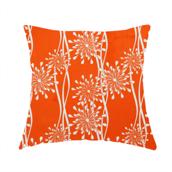 The fabric used to create this handmade cushion is a modern botanical fabric featuring abstract, starburst floral or dandelion motifs paired with vertical wavy lines.