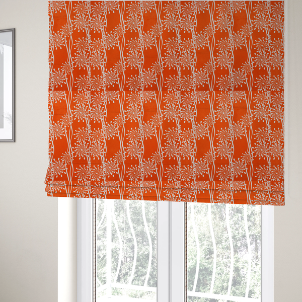 The fabric used to create these Roman blinds is a modern botanical fabric featuring abstract, starburst floral or dandelion motifs paired with vertical wavy lines.