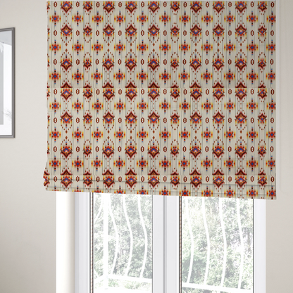The fabric used to create these Roman blinds is a off-white fabric featuring a vibrant Southwestern Aztec and ikat-style geometric pattern.