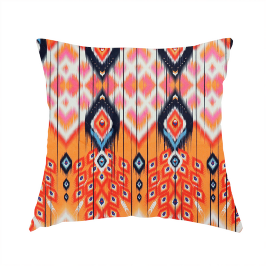 The fabric used to create this handmade cushion is a vibrant orange fabric featuring a bold Southwestern Aztec and ikat-style geometric pattern.