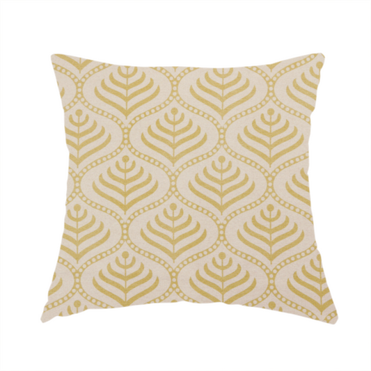 The fabric used to create this handmade cushion is a decorative, vintage-inspired textile pattern characterized by repeating ogival ogee arches filled with stylized leaf or feather motifs and dotted framing lines, rendered in gold or mustard yellow on a light neutral background.