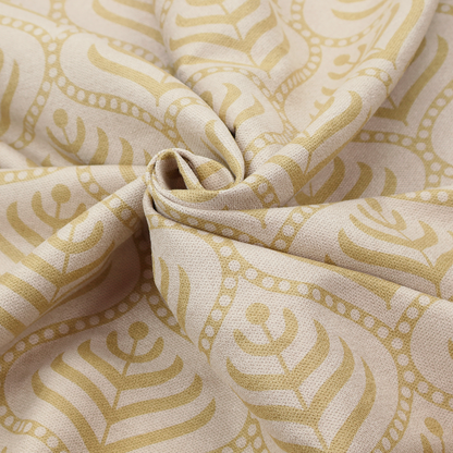 A decorative, vintage-inspired textile pattern characterized by repeating ogival ogee arches filled with stylized leaf or feather motifs and dotted framing lines, rendered in gold or mustard yellow on a light neutral background.