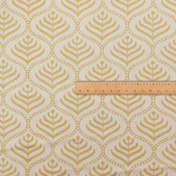 A decorative, vintage-inspired textile pattern characterized by repeating ogival ogee arches filled with stylized leaf or feather motifs and dotted framing lines, rendered in gold or mustard yellow on a light neutral background.