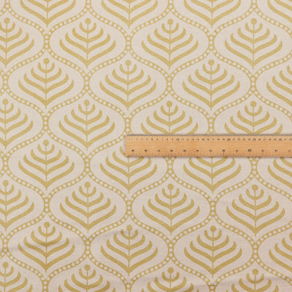 A decorative, vintage-inspired textile pattern characterized by repeating ogival ogee arches filled with stylized leaf or feather motifs and dotted framing lines, rendered in gold or mustard yellow on a light neutral background.