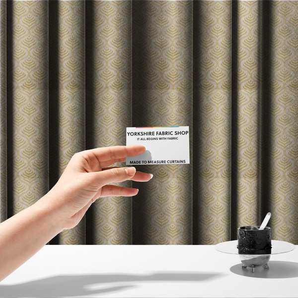The fabric used to create these made-to-measure curtains is a decorative, vintage-inspired textile pattern characterized by repeating ogival ogee arches filled with stylized leaf or feather motifs and dotted framing lines, rendered in gold or mustard yellow on a light neutral background.