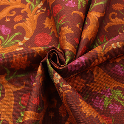 A repeating pattern of ornate, golden-orange baroque scrolls and acanthus leaves intermixed with detailed botanical elements including red roses, magenta tulips, and green foliage, all set against a deep crimson red background.