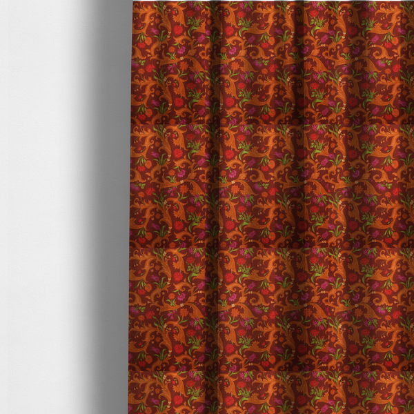 The fabric used to create these made-to-measure curtains is a repeating pattern of ornate, golden-orange baroque scrolls and acanthus leaves intermixed with detailed botanical elements including red roses, magenta tulips, and green foliage, all set against a deep crimson red background.