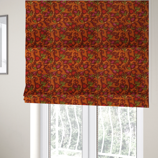 The fabric used to create these Roman blinds is a repeating pattern of ornate, golden-orange baroque scrolls and acanthus leaves intermixed with detailed botanical elements including red roses, magenta tulips, and green foliage, all set against a deep crimson red background.