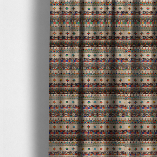 The fabric used to create these made-to-measure curtains is a multi-coloured ethnic geometric fabric with repeating rows of colourful tribal diamonds, zigzags, and striped borders set against a light neutral background.