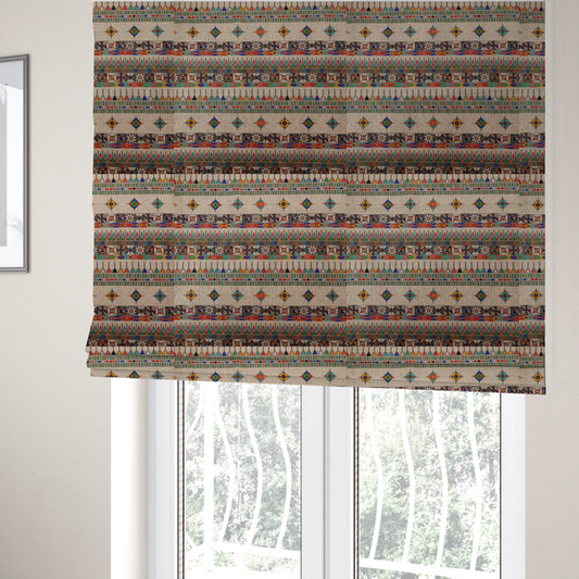 The fabric used to create these Roman blinds is a multi-coloured ethnic geometric fabric with repeating rows of colourful tribal diamonds, zigzags, and striped borders set against a light neutral background.