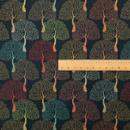 A colourful, intricately patterned tree crowns in shades of red, teal, gold, and green on a dark background.