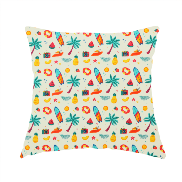 The fabric used to create this handmade cushion is a playful summer pattern of surfboards, palm trees, pineapples, and cameras on a light background.