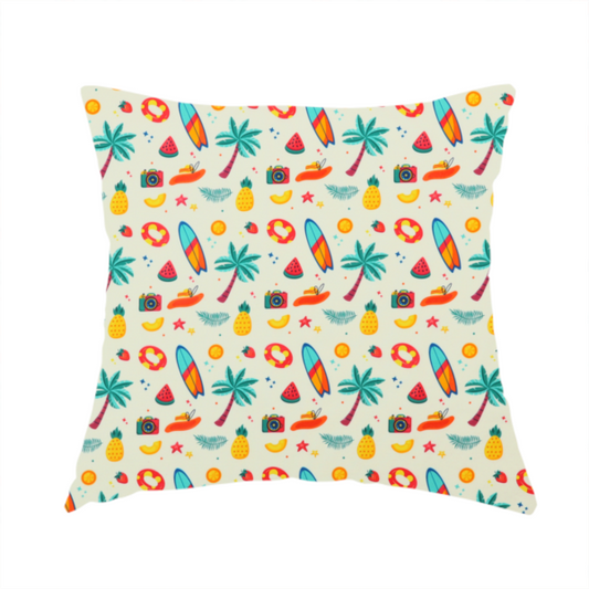 The fabric used to create this handmade cushion is a playful summer pattern of surfboards, palm trees, pineapples, and cameras on a light background.