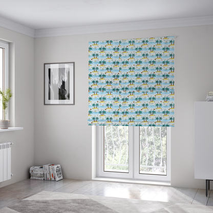 The fabric used to create these Roman blinds is a repeating pattern of cartoon tropical islands with palm trees, blue ocean waves, clouds, and suns on a light blue background.