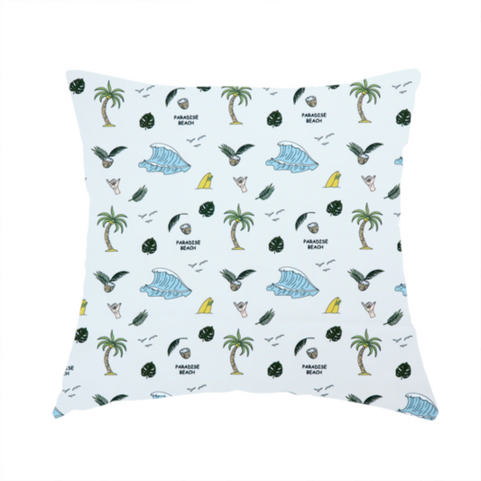 The fabric used to create this handmade cushion is a playful pattern of ocean waves, palm trees, surfboards, and tropical leaves on a light background.