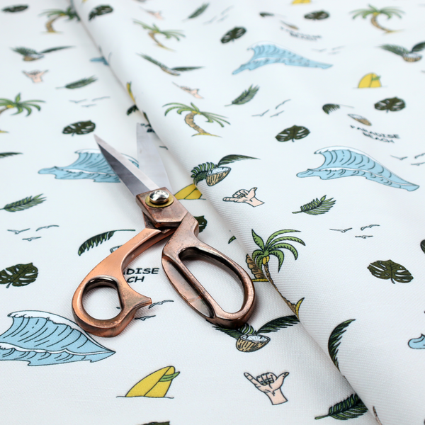 A playful pattern of ocean waves, palm trees, surfboards, and tropical leaves on a light background.