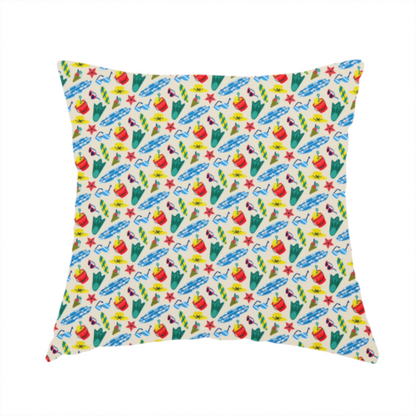 The fabric used to create this handmade cushion is a vibrant, repeating beach-themed pattern on a light cream background, featuring small illustrations of blue and white surfboards, red buckets, green swim flippers, sunglasses, yellow sunhats, starfishes, and popsicles.