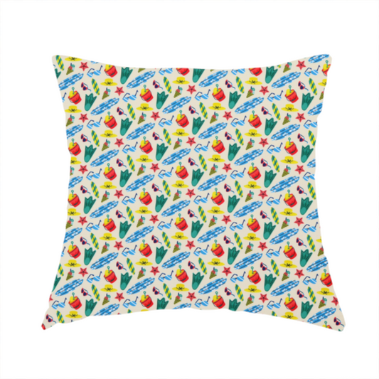 The fabric used to create this handmade cushion is a vibrant, repeating beach-themed pattern on a light cream background, featuring small illustrations of blue and white surfboards, red buckets, green swim flippers, sunglasses, yellow sunhats, starfishes, and popsicles.