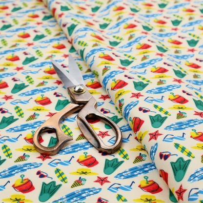 A vibrant, repeating beach-themed pattern on a light cream background, featuring small illustrations of blue and white surfboards, red buckets, green swim flippers, sunglasses, yellow sunhats, starfishes, and popsicles.