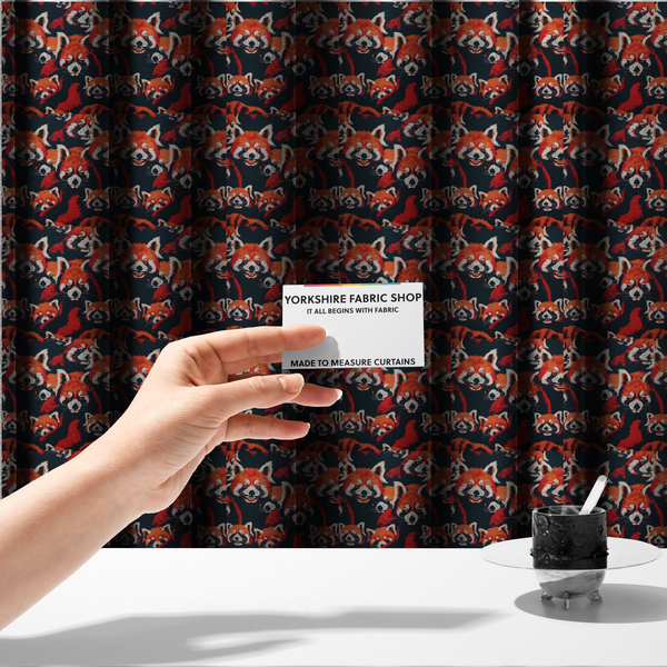 The fabric used to create these made-to-measure curtains is a stylized, vibrant red pandas with white and black facial markings against a dark navy blue background.