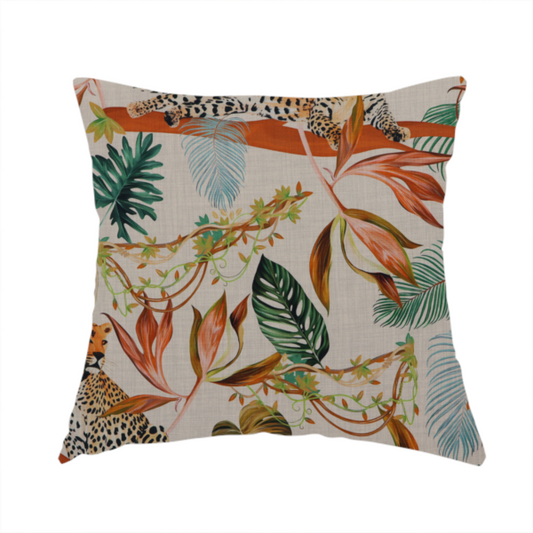 The fabric used to create this handmade cushion is a lounging leopards surrounded by vibrant tropical leaves, monstera fronds, and vines on a light-coloured background.