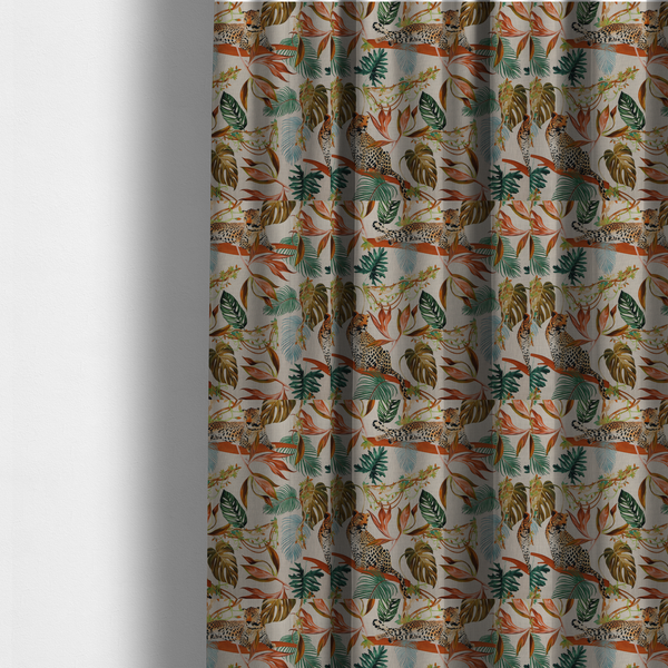 The fabric used to create these made-to-measure curtains is a lounging leopards surrounded by vibrant tropical leaves, monstera fronds, and vines on a light-coloured background.