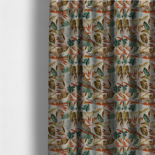 The fabric used to create these made-to-measure curtains is a lounging leopards surrounded by vibrant tropical leaves, monstera fronds, and vines on a light-coloured background.