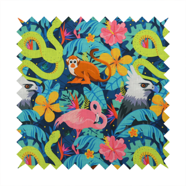 Vibrant jungle fabric pattern featuring neon green snakes, orange monkeys, pink flamingos, and harpy eagles surrounded by tropical flowers and blue foliage on a dark blue background.