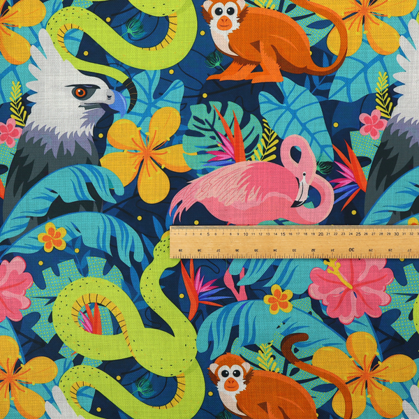 Vibrant jungle fabric pattern featuring neon green snakes, orange monkeys, pink flamingos, and harpy eagles surrounded by tropical flowers and blue foliage on a dark blue background.