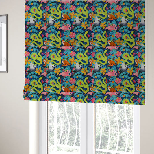 The fabric used to create these Roman blinds has neon green snakes, orange monkeys, pink flamingos, and harpy eagles surrounded by tropical flowers and blue foliage on a dark blue background.