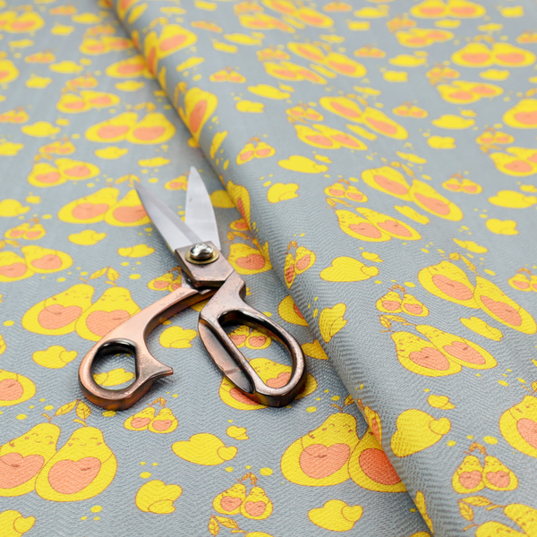 A repeating pattern of paired, smiling yellow pears with pink heart-shaped centres on a light blue-grey herringbone background.