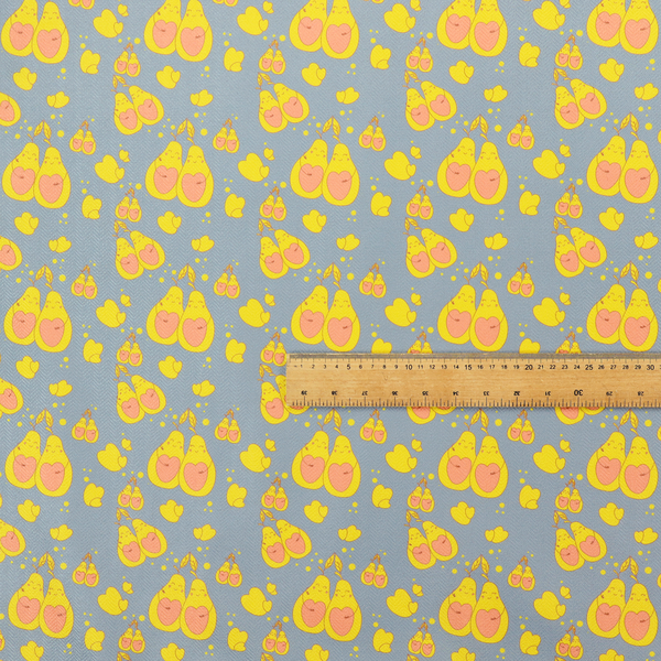 A repeating pattern of paired, smiling yellow pears with pink heart-shaped centres on a light blue-grey herringbone background.