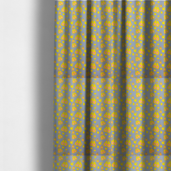 The fabric used to create these made-to-measure curtains is a repeating pattern of paired, smiling yellow pears with pink heart-shaped centres on a light blue-grey herringbone background.