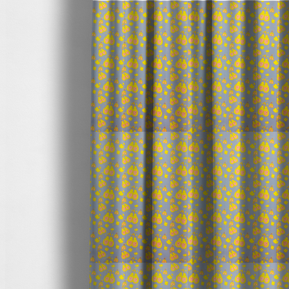 The fabric used to create these made-to-measure curtains is a repeating pattern of paired, smiling yellow pears with pink heart-shaped centres on a light blue-grey herringbone background.