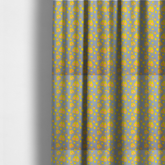 The fabric used to create these made-to-measure curtains is a repeating pattern of paired, smiling yellow pears with pink heart-shaped centres on a light blue-grey herringbone background.