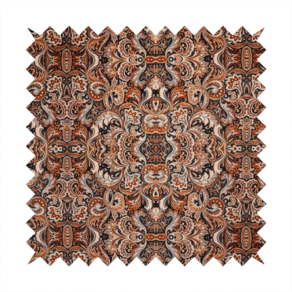A dense, intricate, and ornate paisley and damask-style repeating pattern featuring rich earth tones of copper, brown, cream, and dark charcoal.