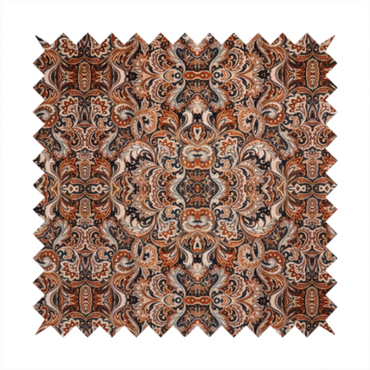 A dense, intricate, and ornate paisley and damask-style repeating pattern featuring rich earth tones of copper, brown, cream, and dark charcoal.