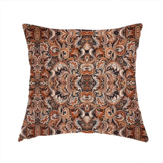 The fabric used to create this handmade cushion is a dense, intricate, and ornate paisley and damask-style repeating pattern featuring rich earth tones of copper, brown, cream, and dark charcoal.